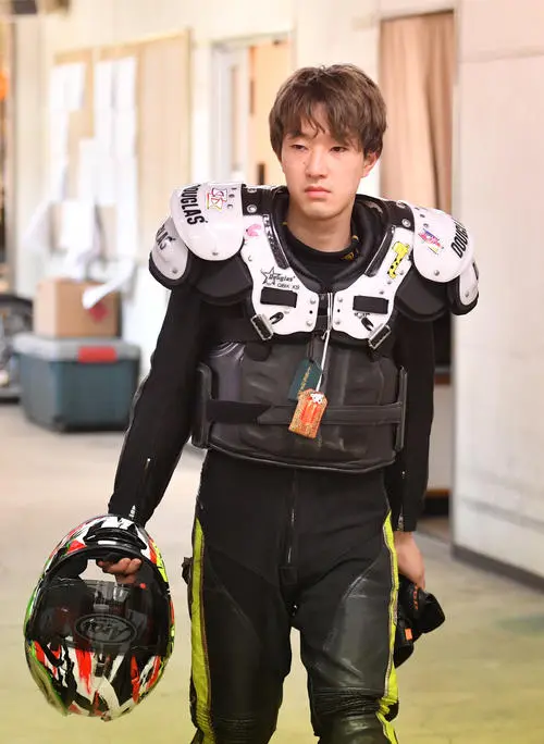 Kyosuke Kurokawa Auto Race rider walking with racing helmet before a race